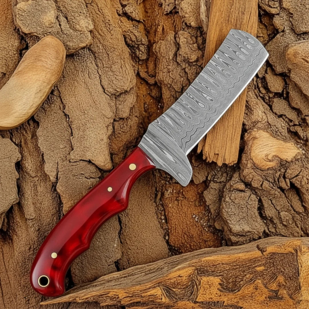 Knife with a red handle on a wooden background