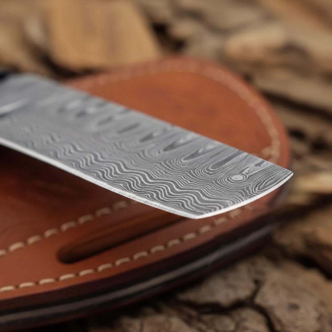 Damascus knife blade on a leather sheath with a natural wood background