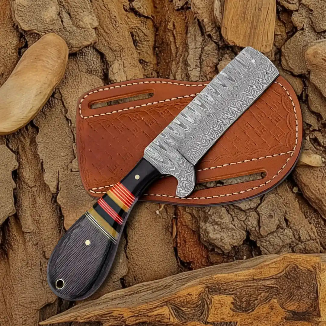 Knife with a decorative handle on a leather sheath against a natural stone background