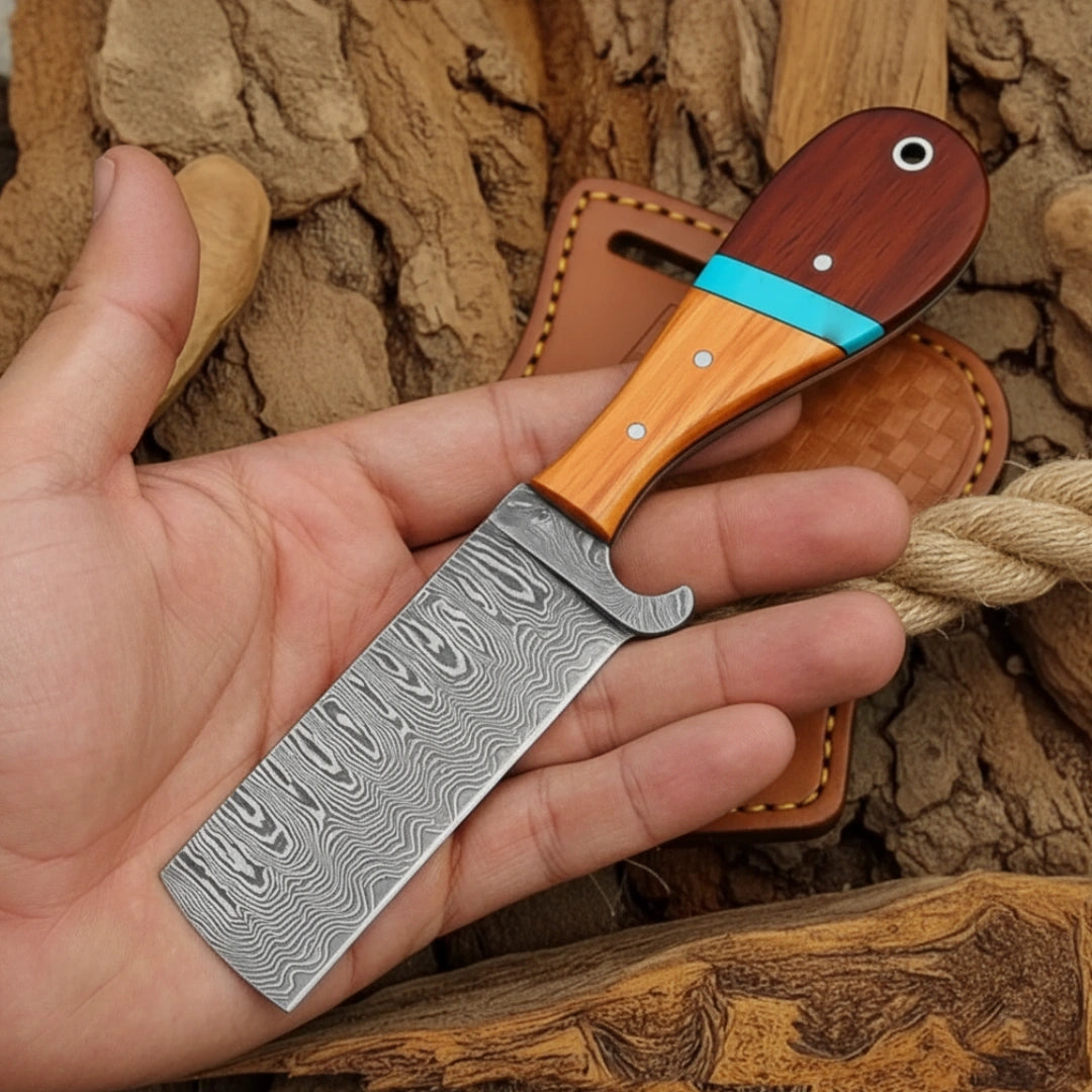 Hand holding a knife with a wooden handle and leather sheath against a natural background