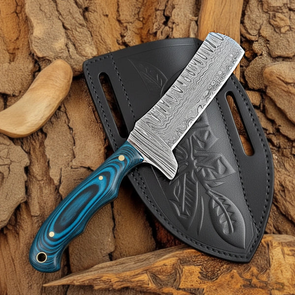 Cowboy-Bull-Cutter Knfie with blue Pakkawood handle and silver blade in a black sheath on a wooden background