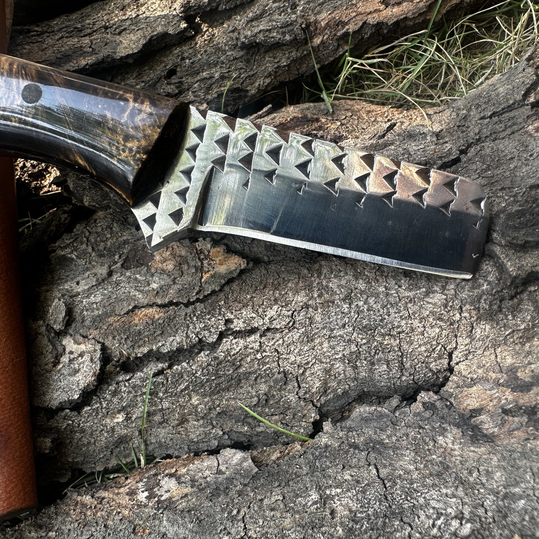 Knife with a rasp Steel blade on a wooden surface