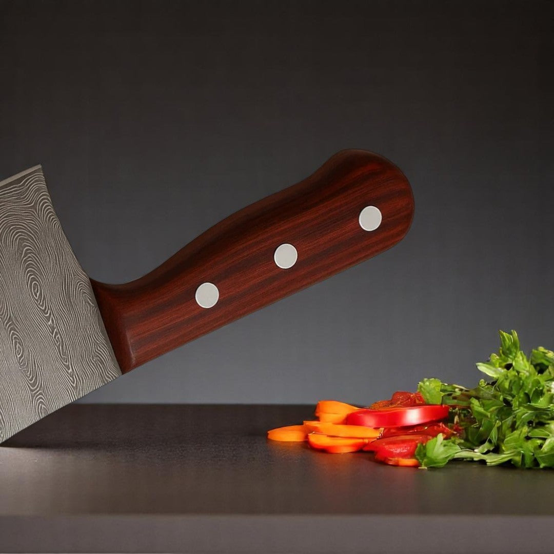 Close-up detail of the reddish-brown wood handle with prominent silver rivets on a Classic Damascus Serbian Chef Knife