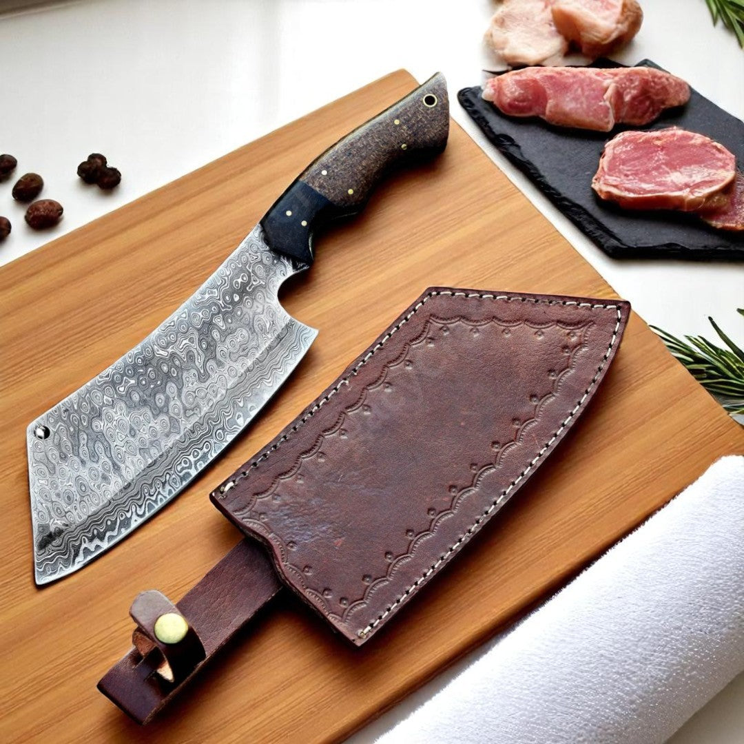 Damascus Butcher Cleaver Knife with Micarta handle, resting on a black surface partially in its brown leather sheath, with raw meat nearby.