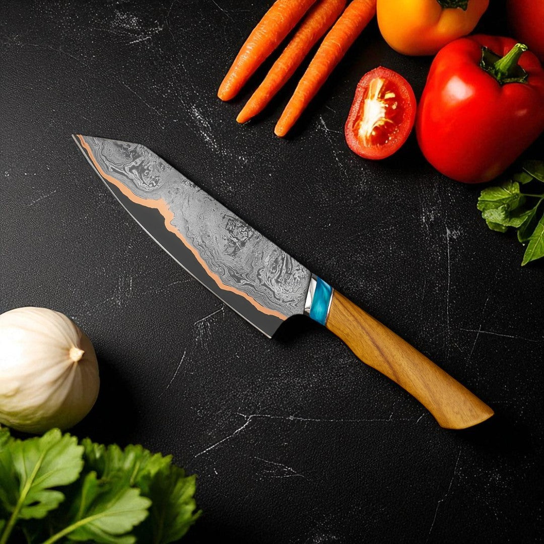 Decorative Copper Damascus Kitchen Knife chef's knife with a wooden handle on a dark surface with vegetables.