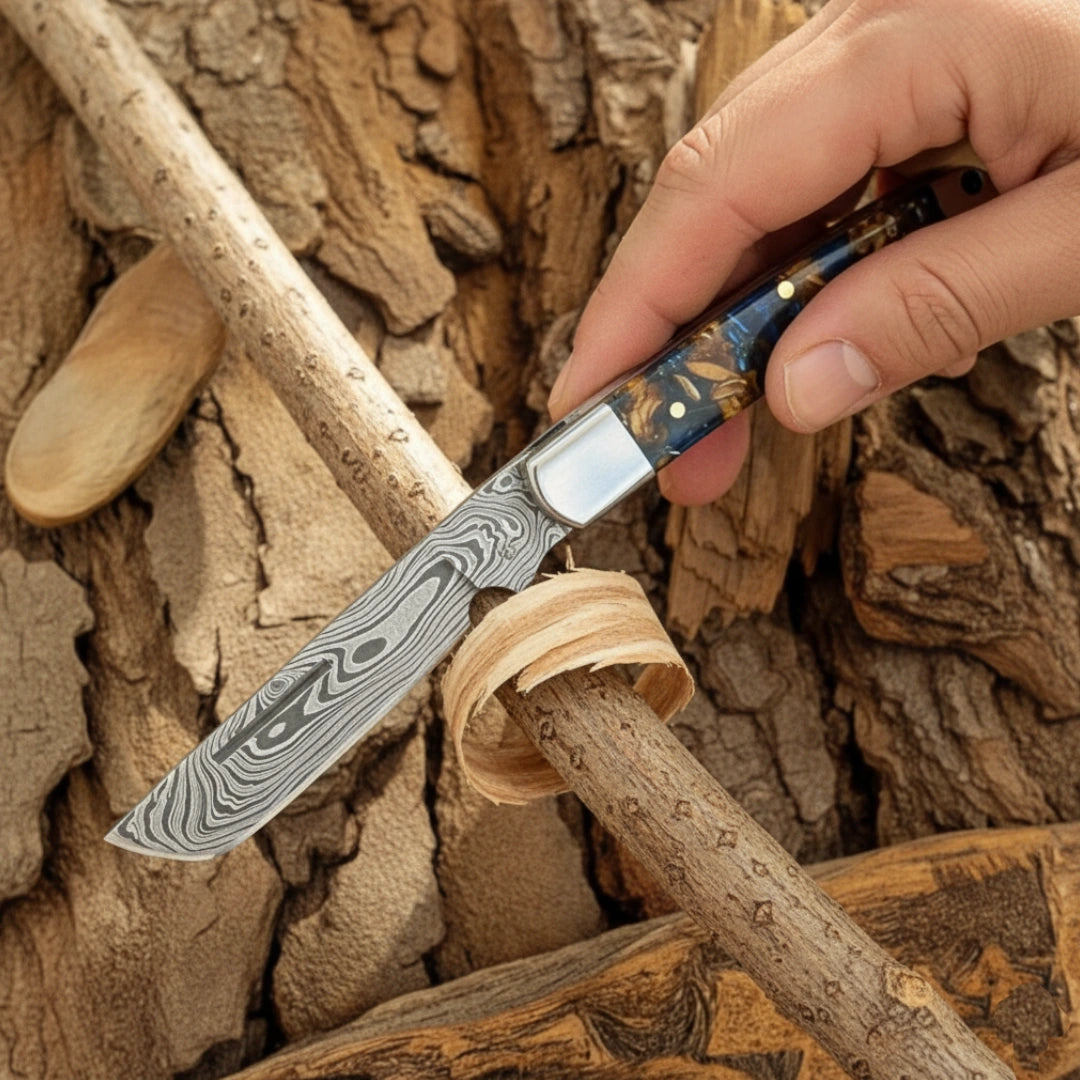 Hand holding a Damascus knife against a wooden background