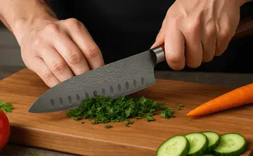 Person holding a knife over a cutting board with vegetables