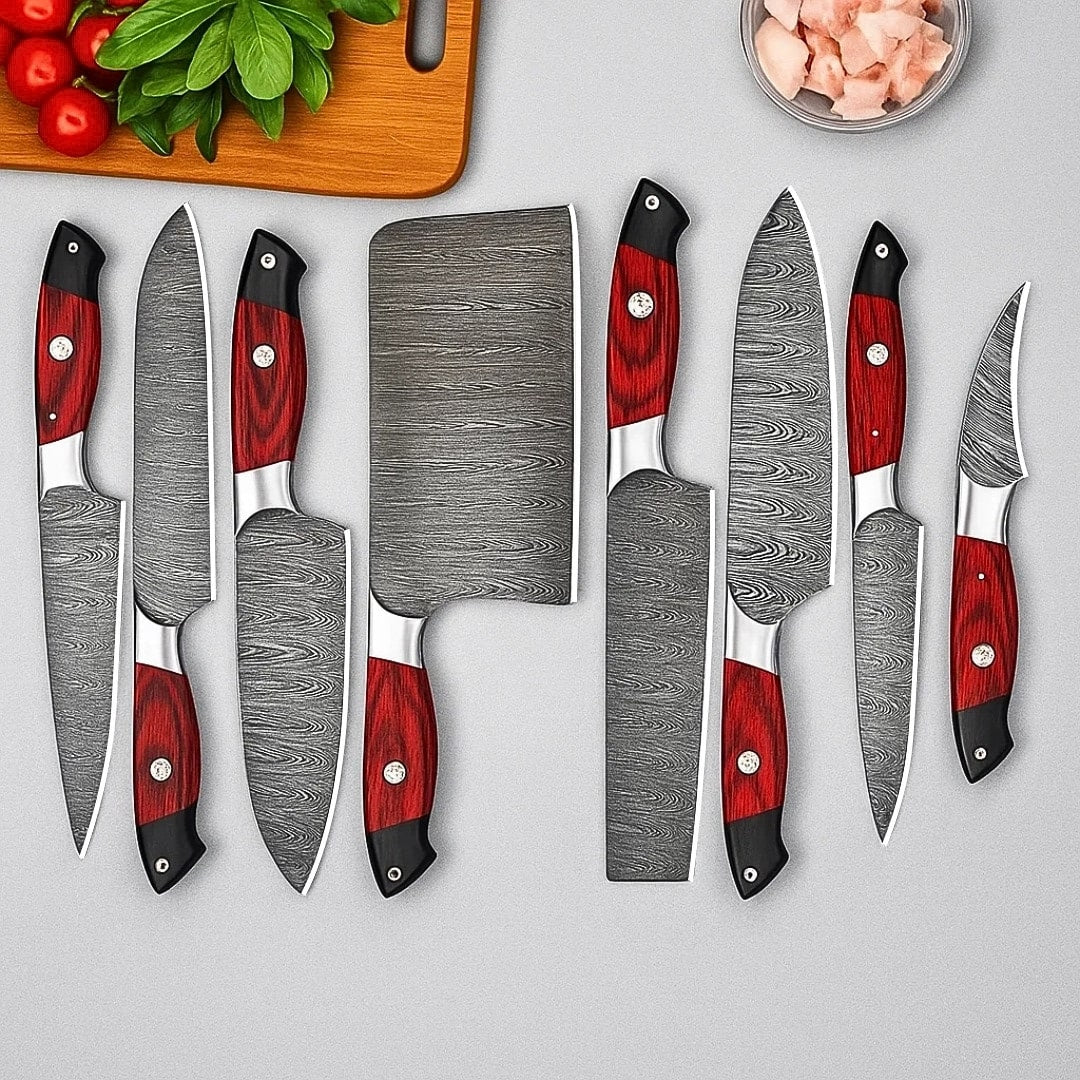 Set of knives with red handles on a gray background
