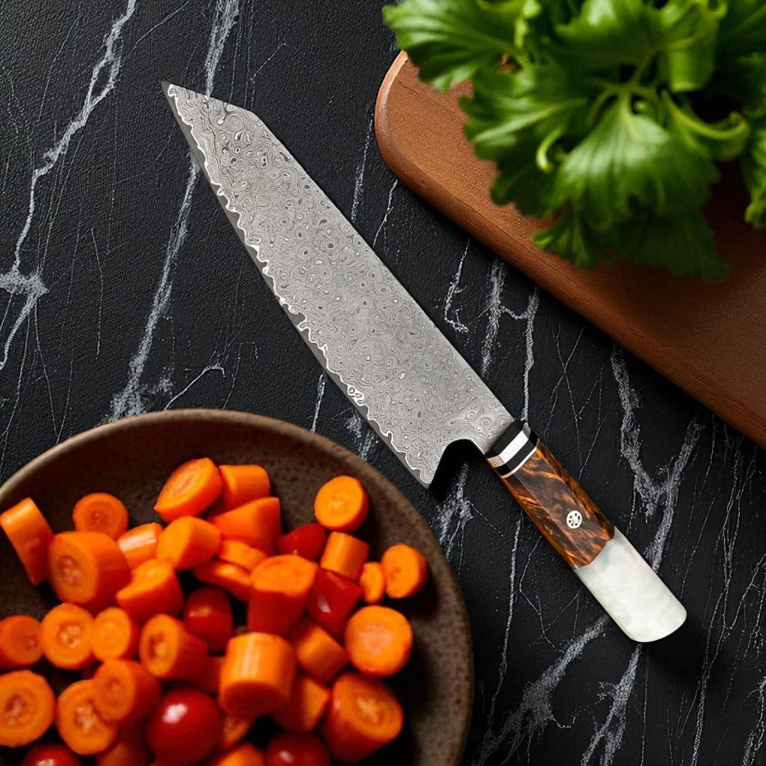 Chef's knife with a wooden handle on a black marble surface next to a bowl of chopped vegetables.