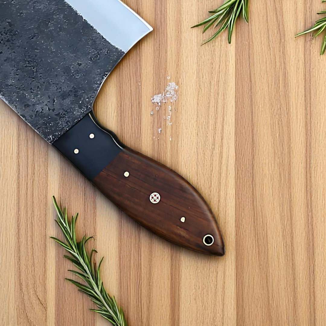 Close-up view of the textured walnut wood handle of the Bone Splitter Serbian Cleaver Knife, showing its ergonomic shape and rivets.