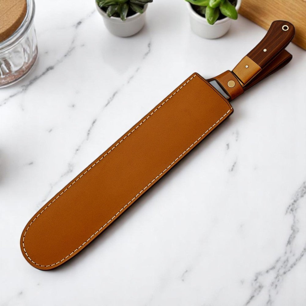 Brown leather knife sheath on a marble surface with small potted plants in the background.