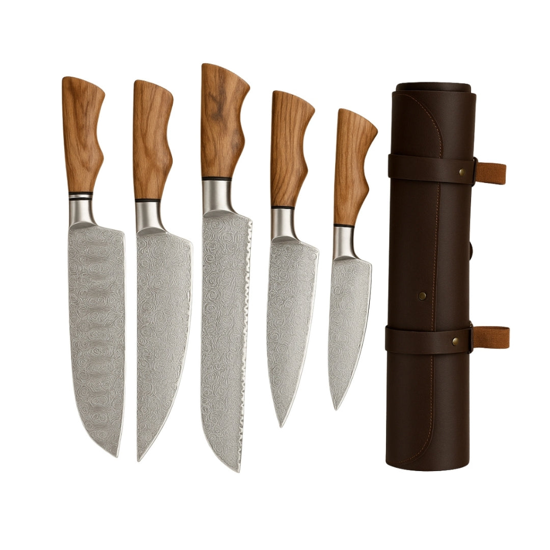 Five handmade Damascus steel chef knives with light wood handles displayed upright next to their brown leather roll bag on a white background