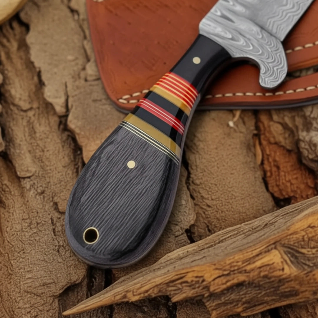 Handcrafted knife with a decorative handle on a wooden surface