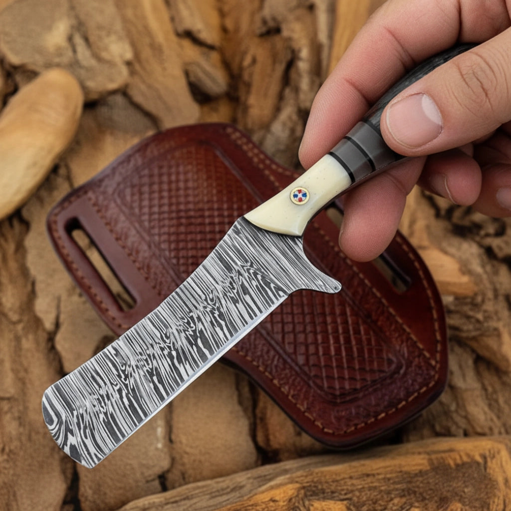 Hand holding 8 inch Damascus Cowboy Bull Cutter Knife with bone and ebony handle over leather sheath.