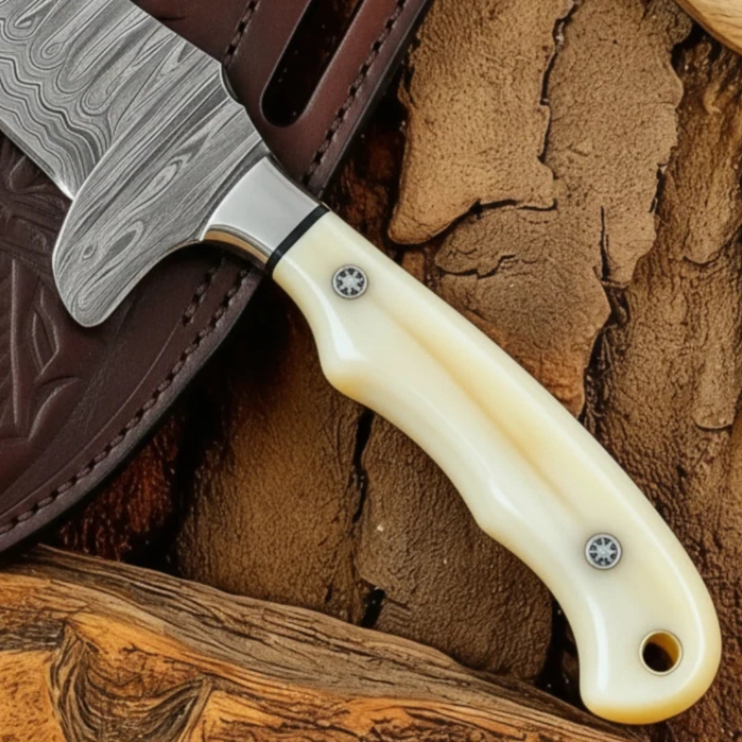 bone handle of Damascus Cowboy Bull Cutter Knife with detailed steel bolster and pins.
