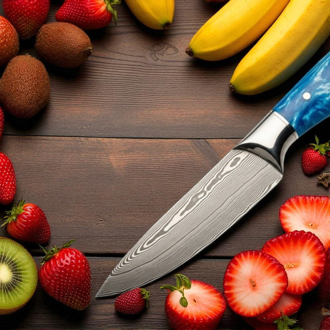  Close-up view of the  Damascus Blade of Paring Knife, showing its vibrant pattern and polished metal bolsters.