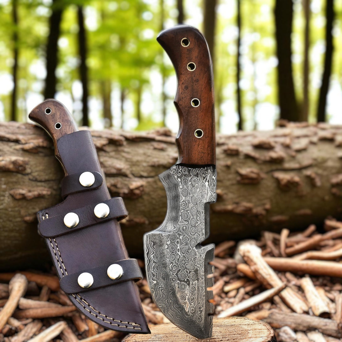 tracker knife with wooden handle and leather sheath on a log with a forest background