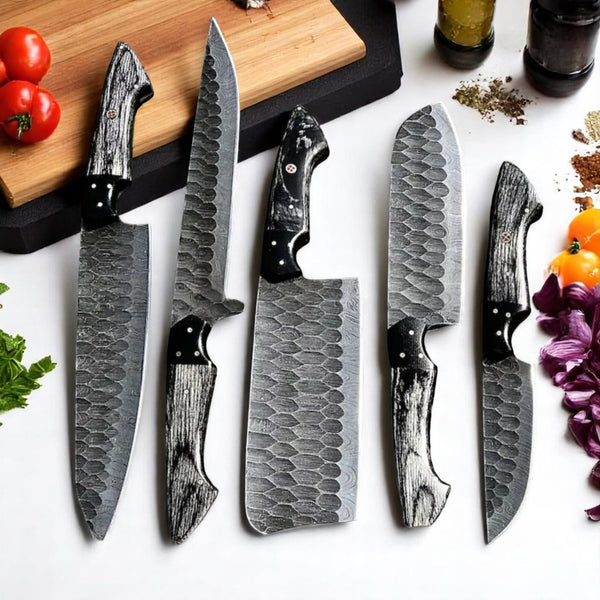 Set of knives with textured handles on a white surface with vegetables.